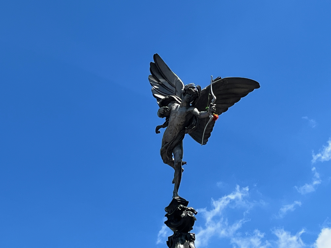 Close-up of the nude winged archer statue on top of the Shaftesbury Memorial Fountain. It is often called Eros, but it's actually believed to represent that Greek God's brother Anteros.