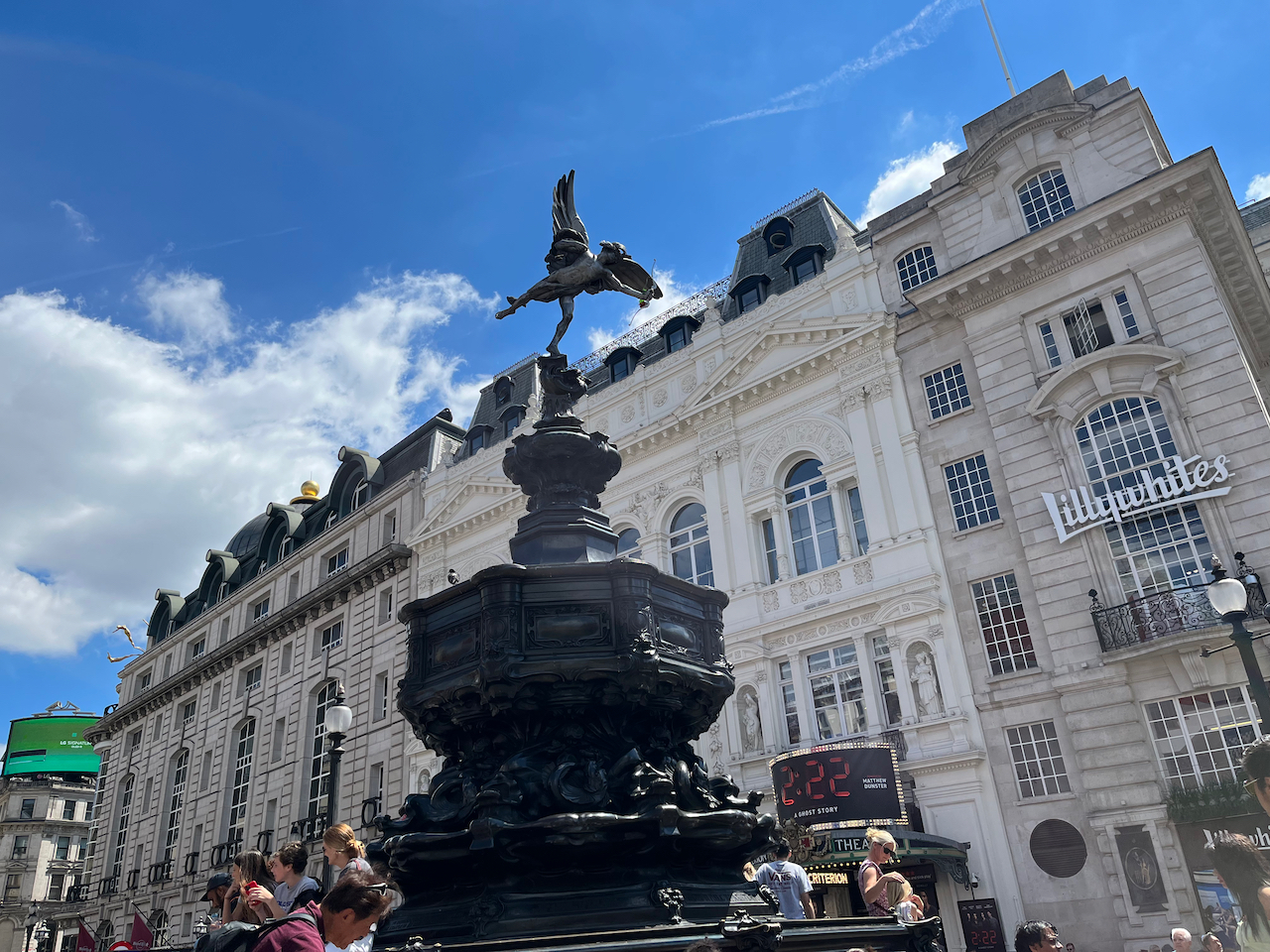 The tall, black, ornate Shaftesbury Memorial fountain in Piccadilly, with the Criterion Theatre in background.