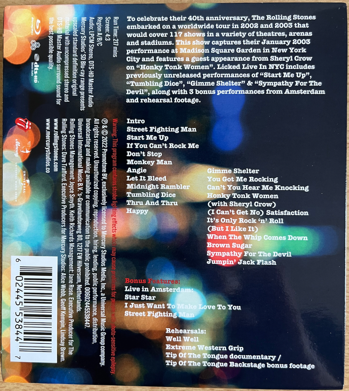Back cover for The Rolling Stones, Licked Live In NYC, listing the songs from the concert and the extra features.