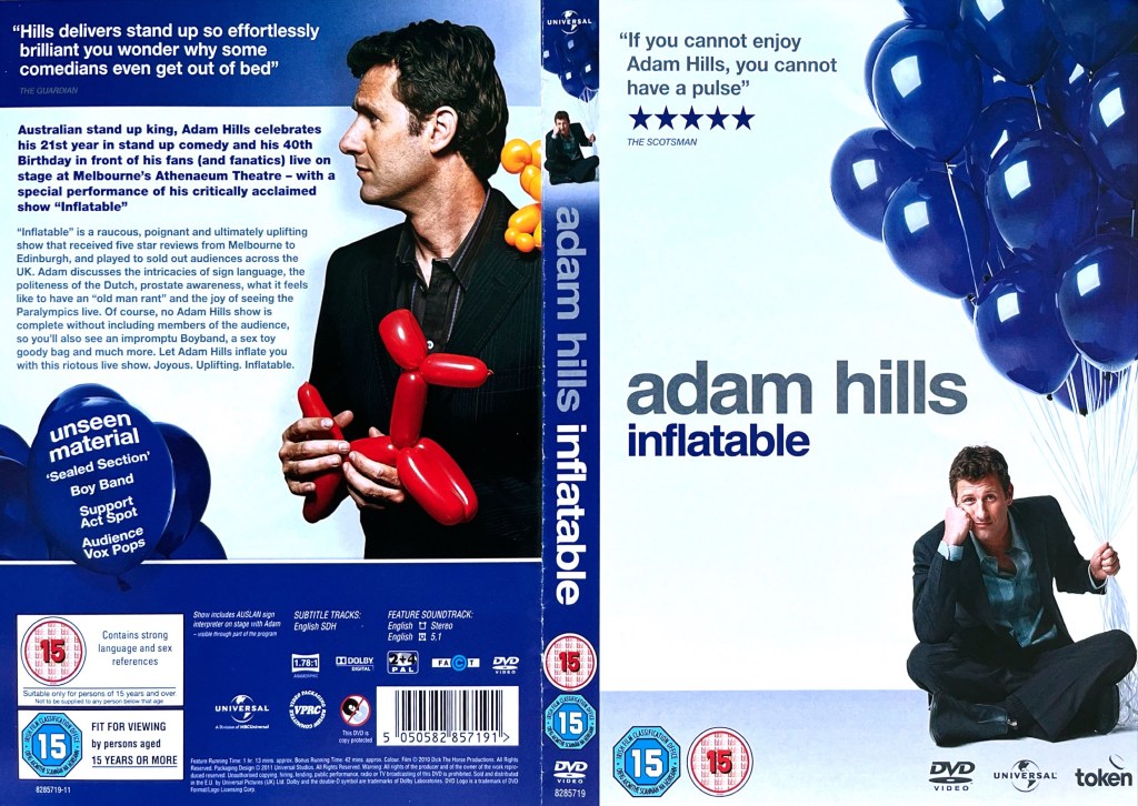 DVD cover spread for Adam Hills - Inflatable. The front cover shows Adam sitting cross-legged on the floor, while holding a string attached to a bunch of big purple balloons above him. Meanwhile on the back cover, alongside the details of the DVD, Adam is shown holding a small red balloon model of a dog.