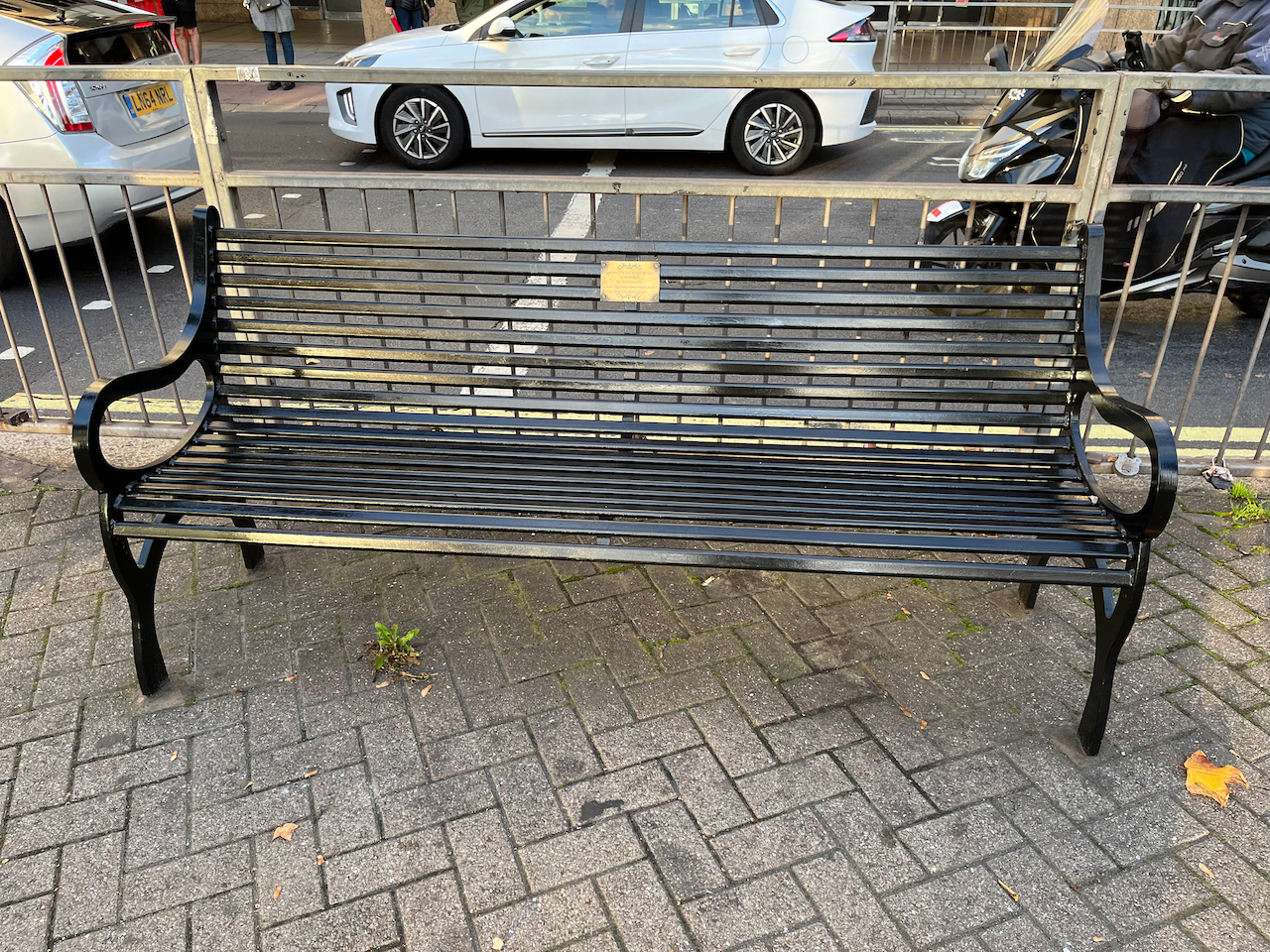 Rik Mayall's black memorial bench.