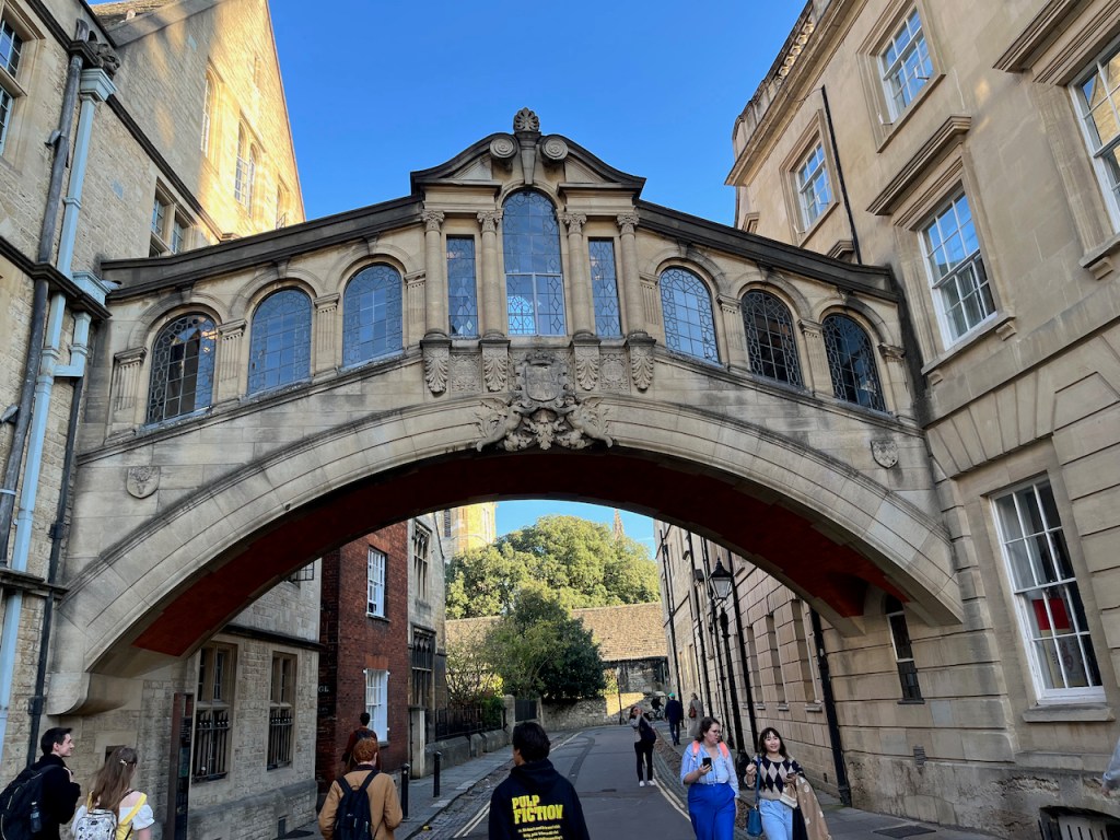 The bridge linking the two buildings of Hertford College. The bridge is an enclosed stone structure with arched windows.
