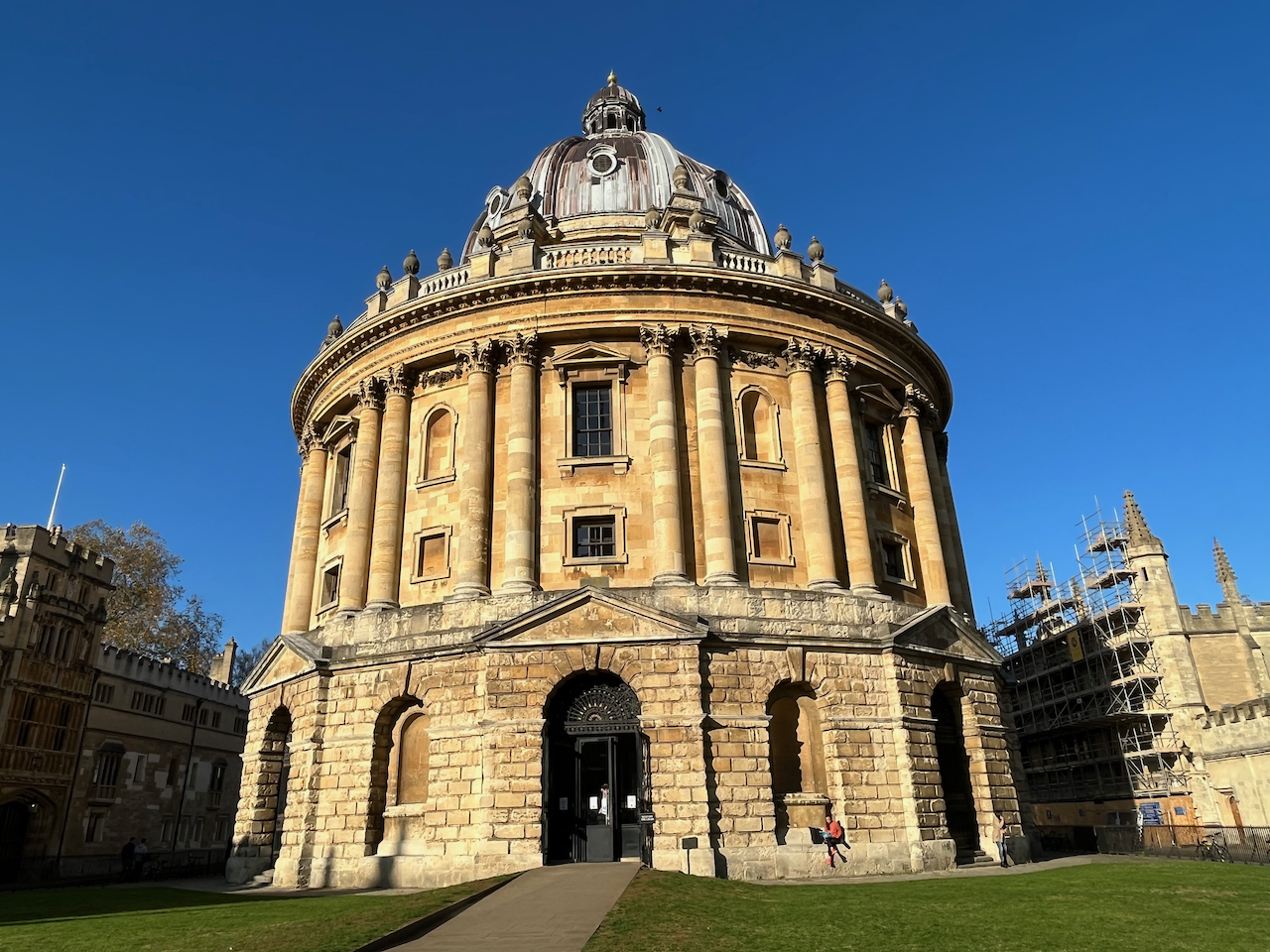 The Radcliffe Camera, a large, round, ornately decorated library building.