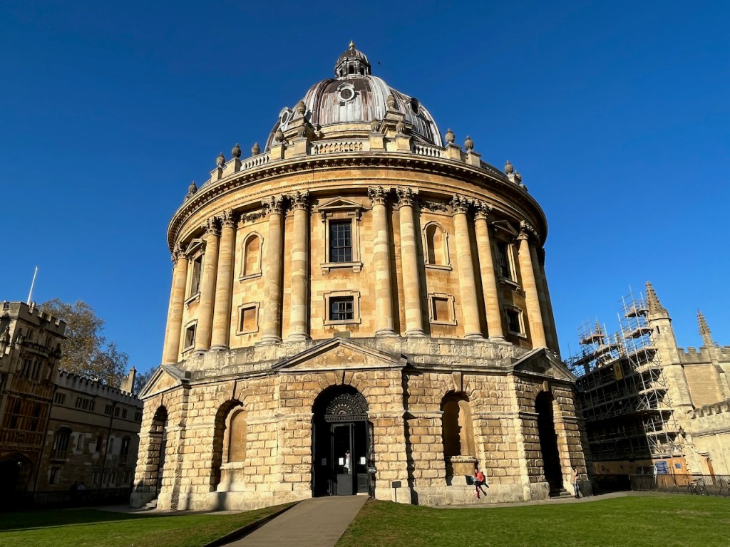 The Radcliffe Camera, a large, round, ornately decorated library building.