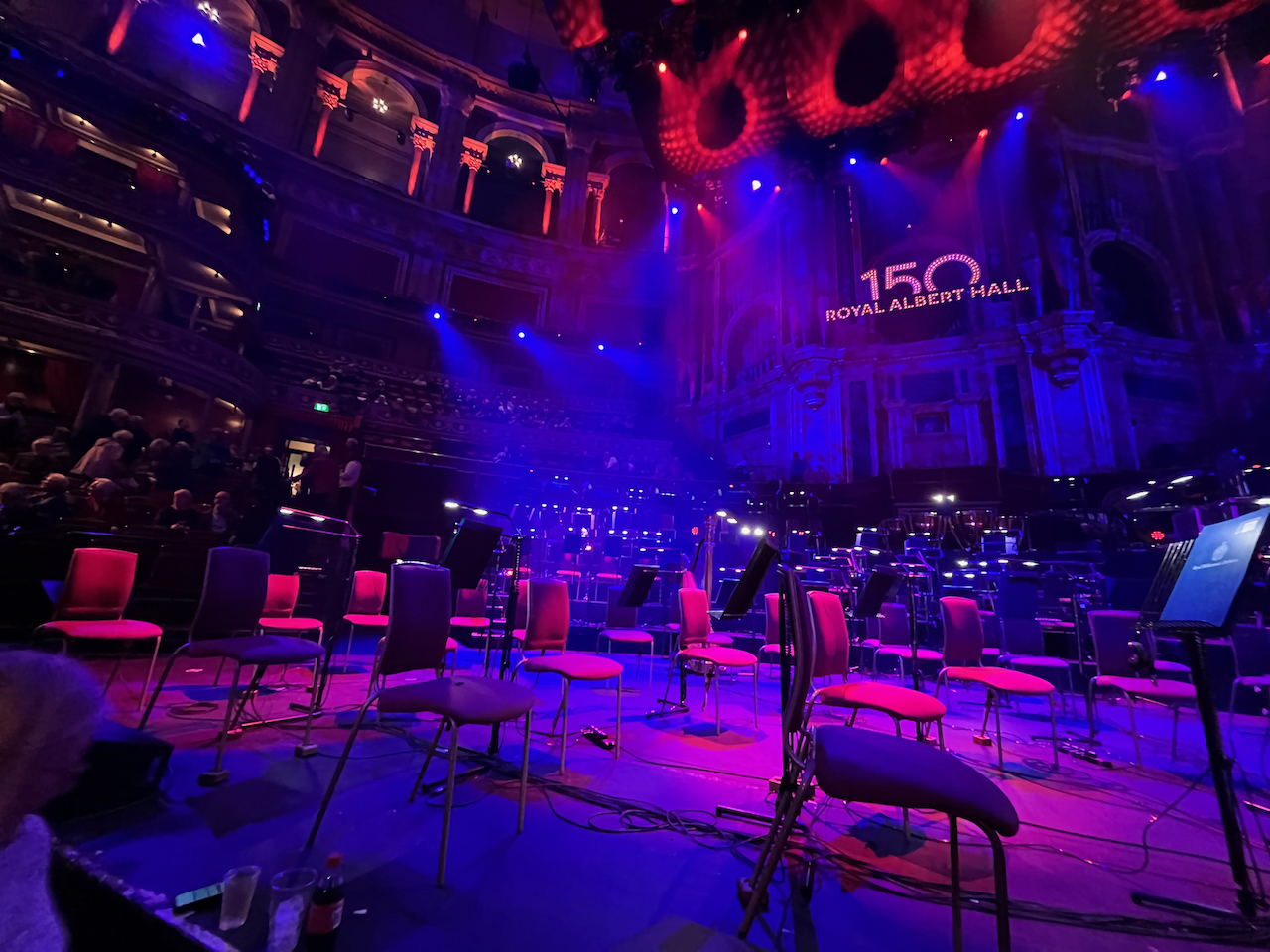 The left side of the stage at the Royal Albert Hall for the Symphonic Queen concert, lit up in blue.