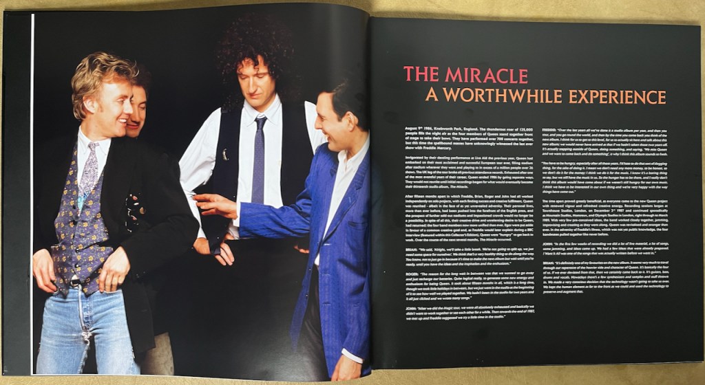 Double-page spread from the book in Queen's box set for The Miracle. The left page shows a photo of the band with Freddie and Roger laughing together, while the right page has 2 columns of text with the heading The Miracle, A Worthwhile Experience.