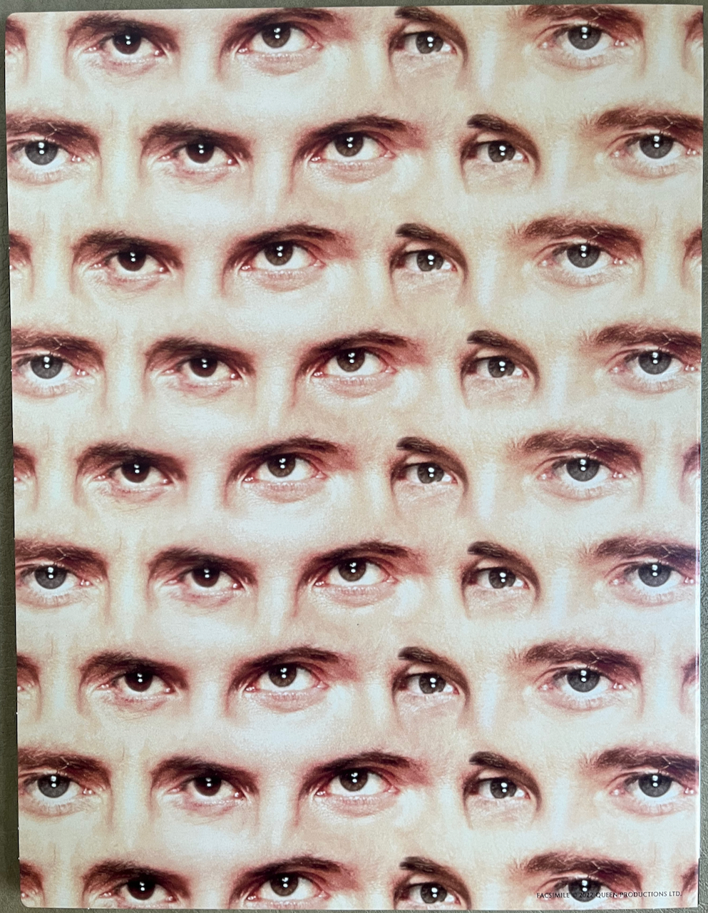 Back cover of the press kit for The Miracle, showing a collage of the band member's eyes, separated by the bridges of their noses.