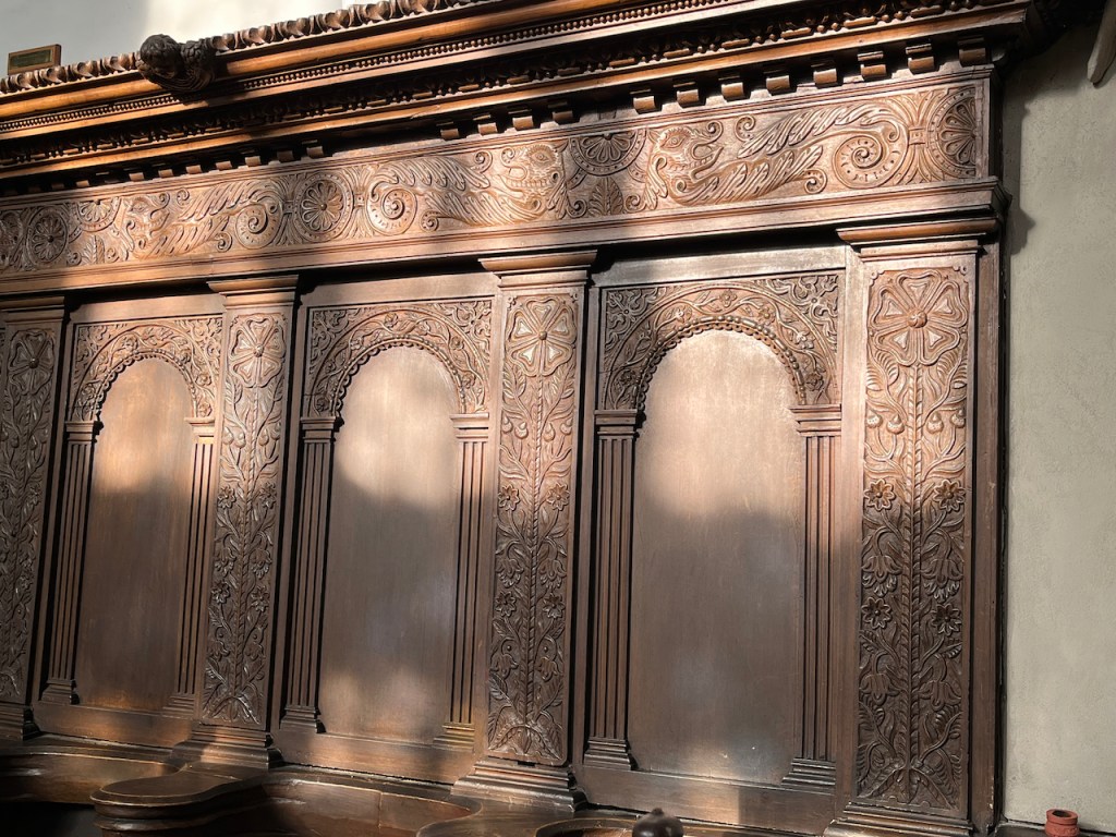 Ornately carved wall panels in Wadham College Chapel.
