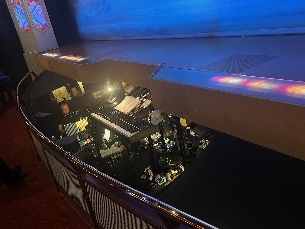 The orchestra pit in front of the stage for The Book Of Mormon, including a large keyboard.