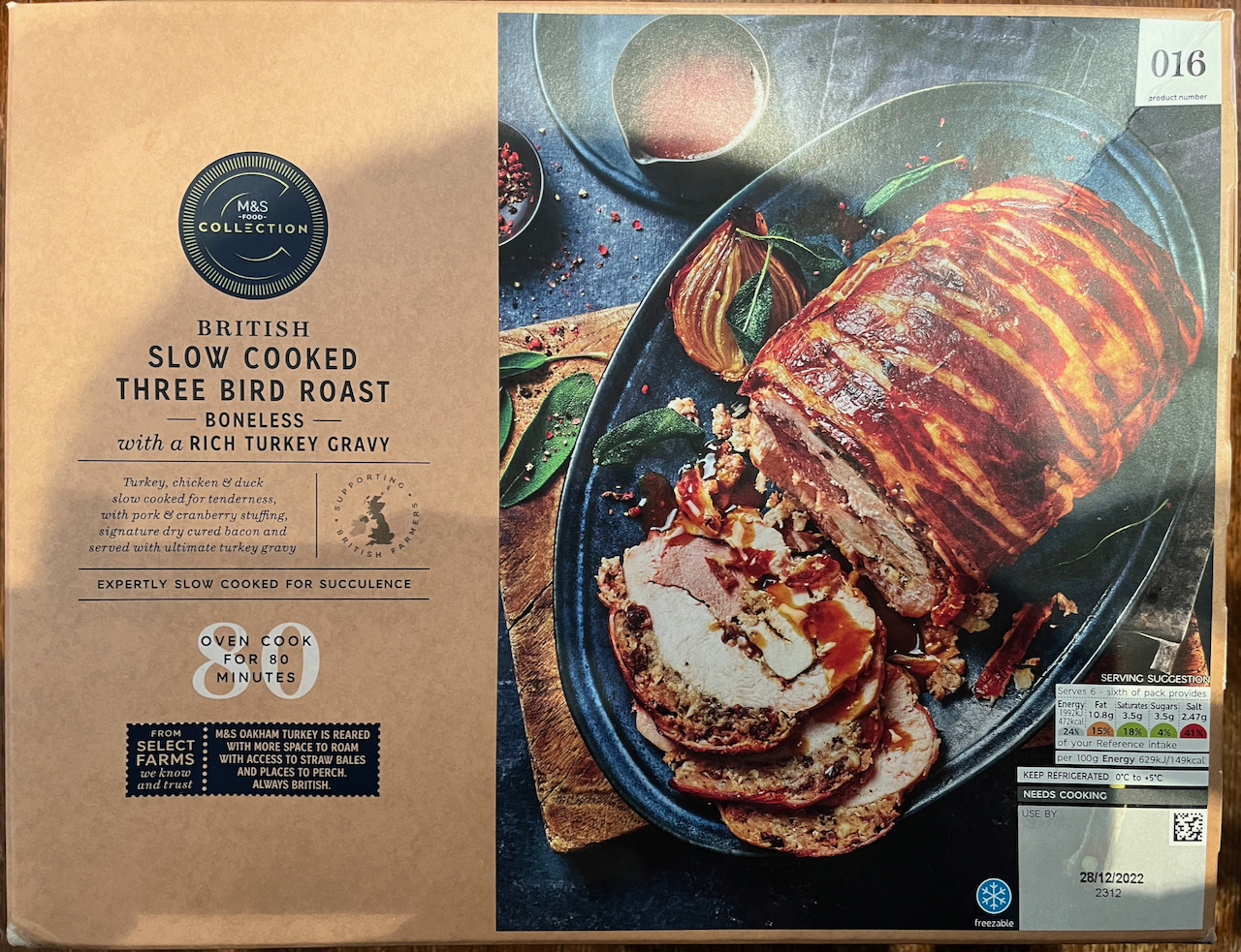 M&S British Slow Cooked Three Bird Roast of turkey, chicken and duck, with bacon, stuffing and rich turkey gravy.