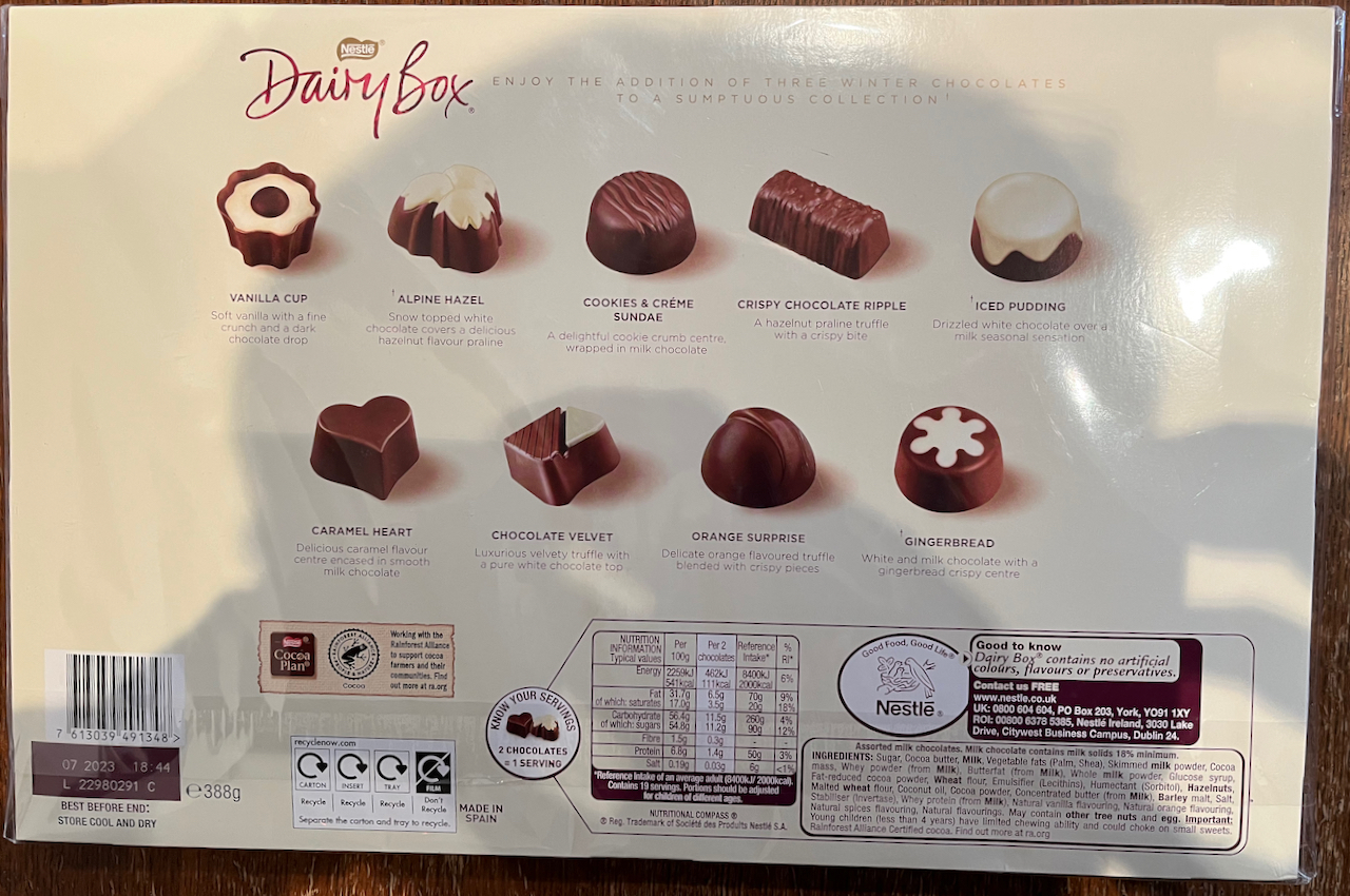The back of the Nestle Winter Collection Dairy Box of chocolates, showing the different varieties, including vanilla cup, alpine hazel, cookies and creme sundae, crispy chocolate ripple, iced pudding, caramel heart, chocolate velvet, orange surprise and gingerbread.