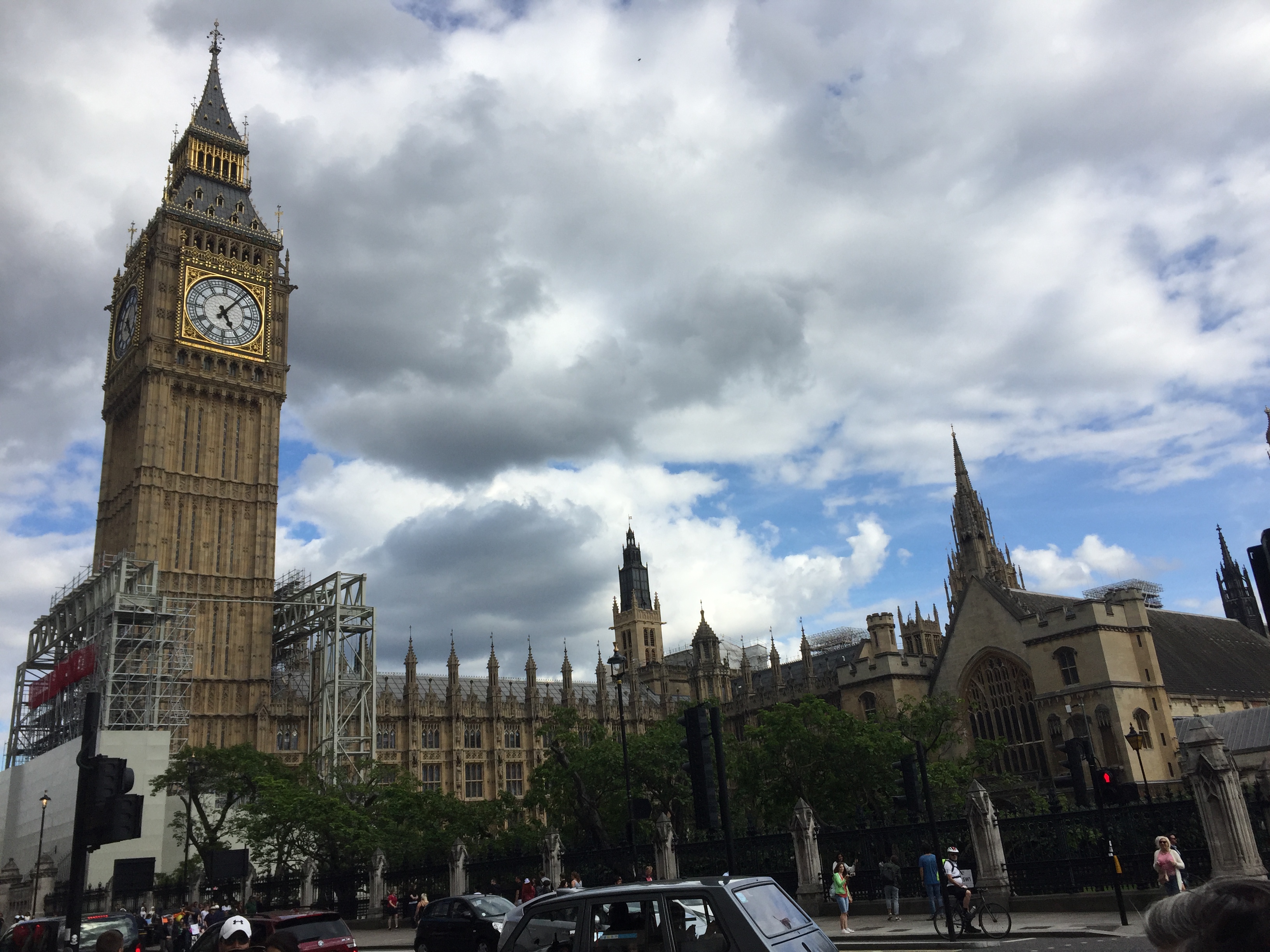 Big Ben, with scaffolding around the bottom of the tower, and the Houses of Parliament next to it.
