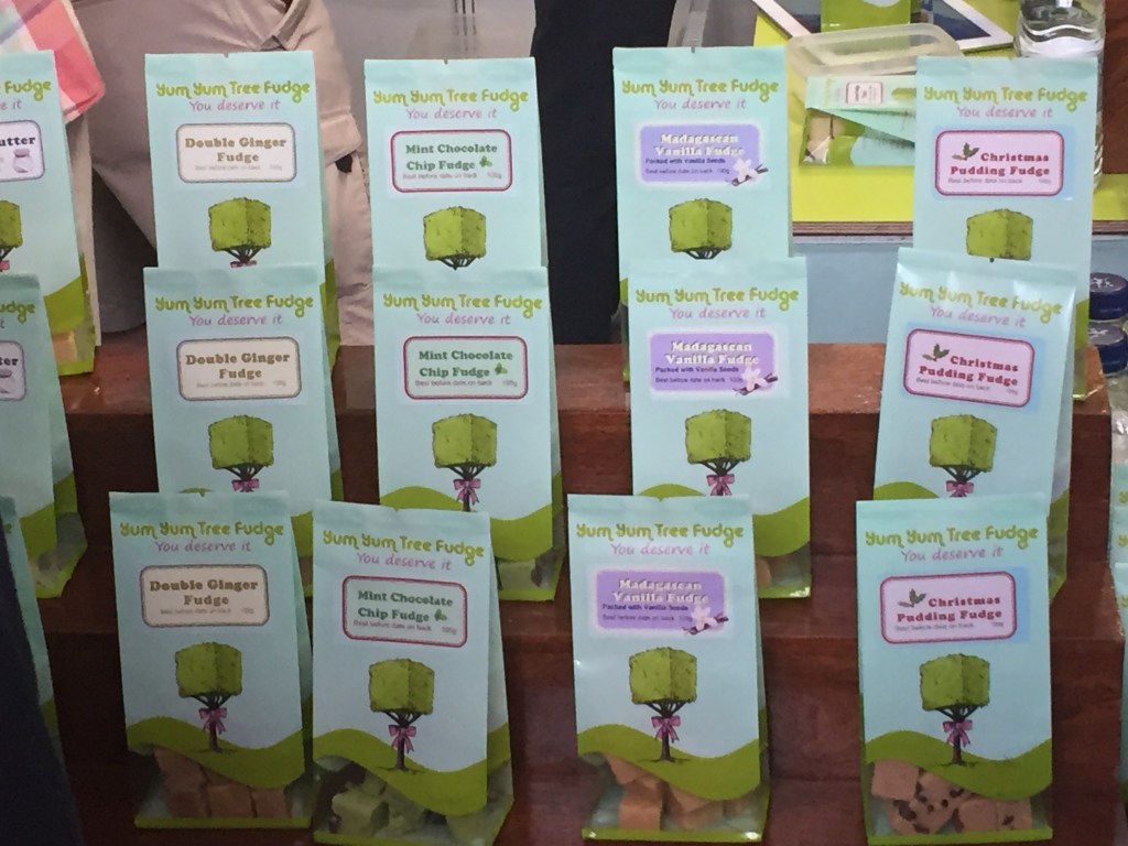 Bags of different flavours of Yum Yum Tree Fudge on their stall at the Chocolate Show, with double ginger, mini chocolate chip, Madagascan vanilla and Christmas pudding varieties.