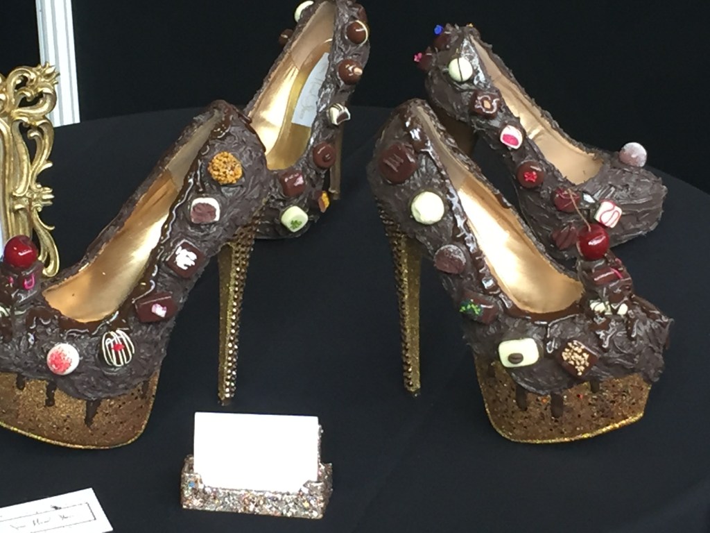 A pair of ornately decorated high heels that are designed to make it look like they're made out of chocolate.