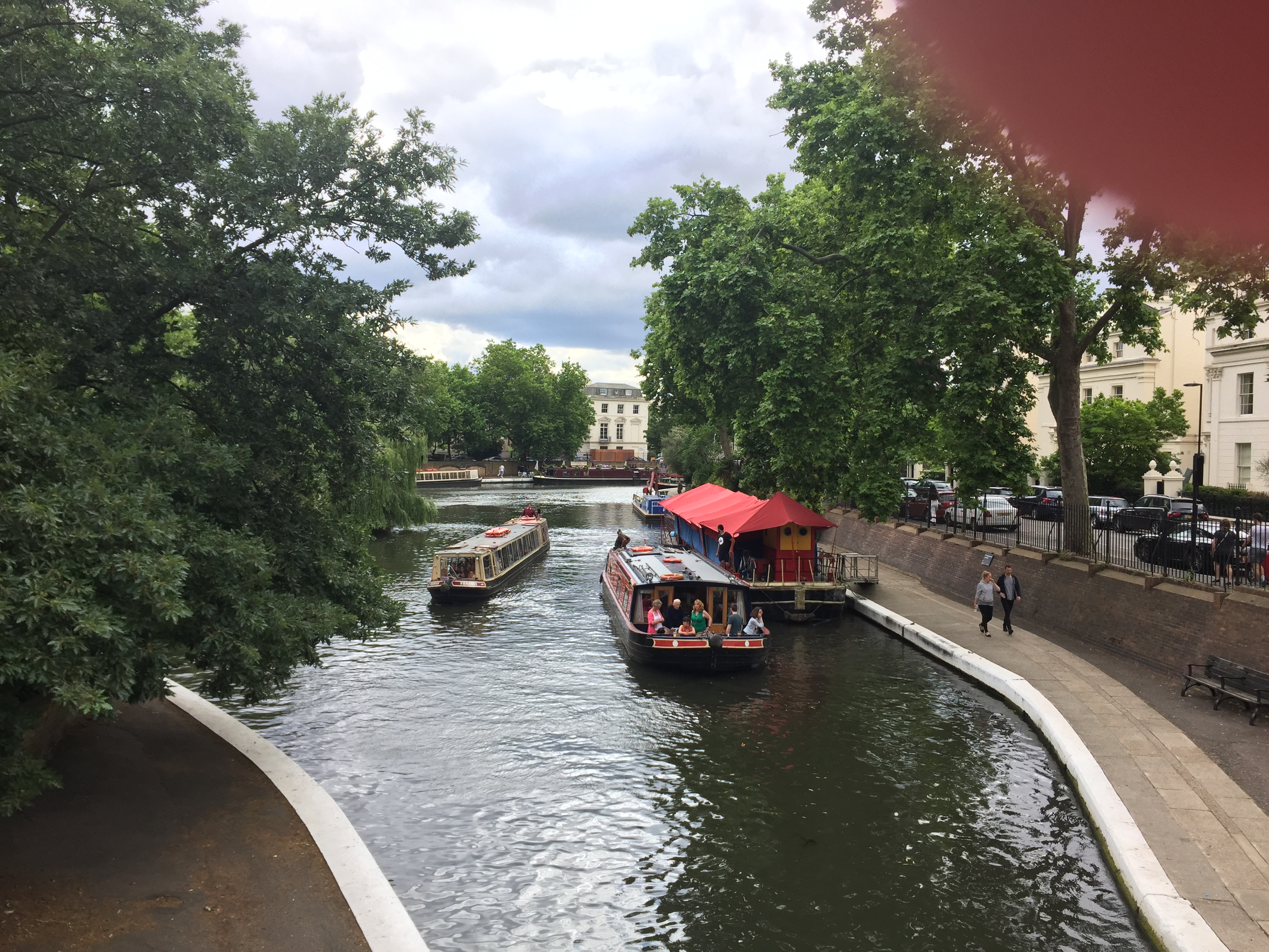 A couple of barges sailing down the canal in Little Venice.