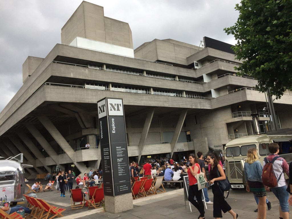 The National Theatre building, a large concrete structure with terraces going around the building on the upper floors.