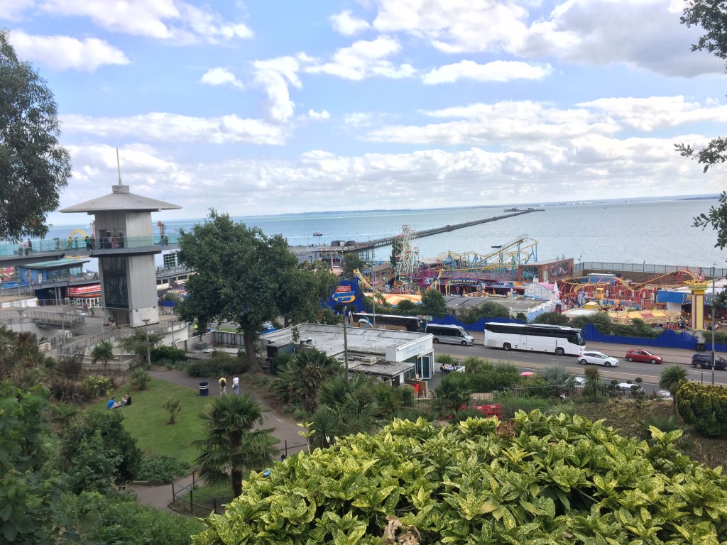 Southend Seafront, with the Adventure Island theme park and the very long pier stretching into the distance, viewed from up on the cliffs.