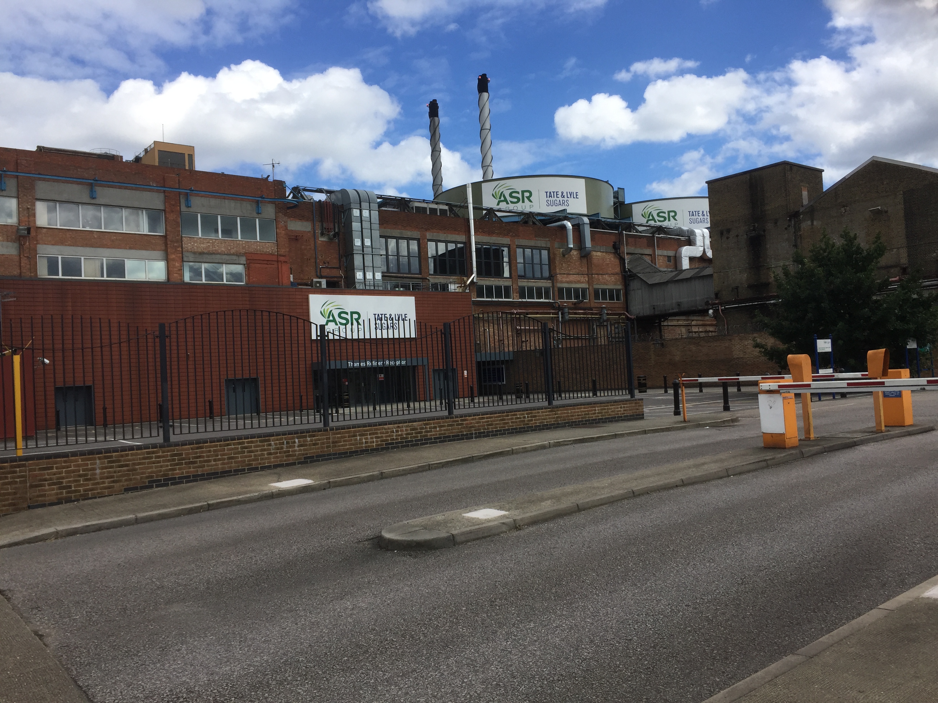 The huge Tate & Lyle Factory, with a couple of tall chimneys.