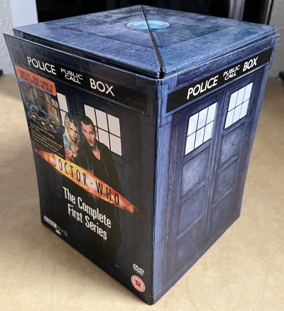 The DVD box set for Doctor Who Series 1, shaped like a blue police box style Tardis.