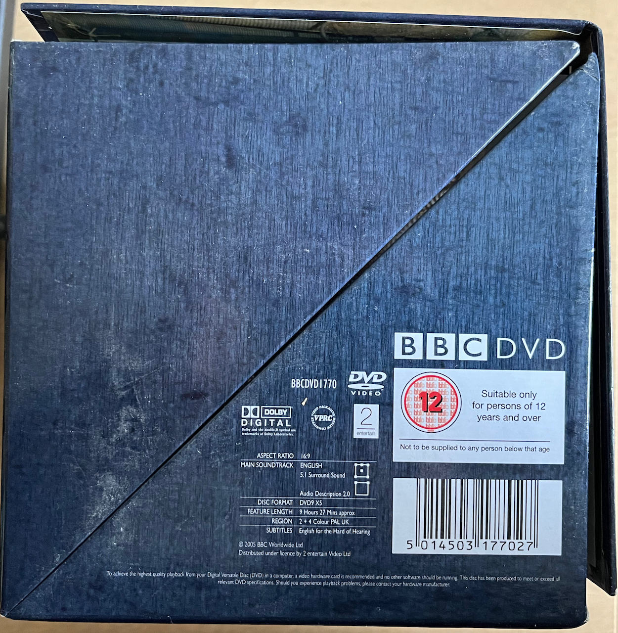 The underside of the Tardis-style DVD box set for Doctor Who Series 1, showing technical specifications, copyright information, logos and barcode.