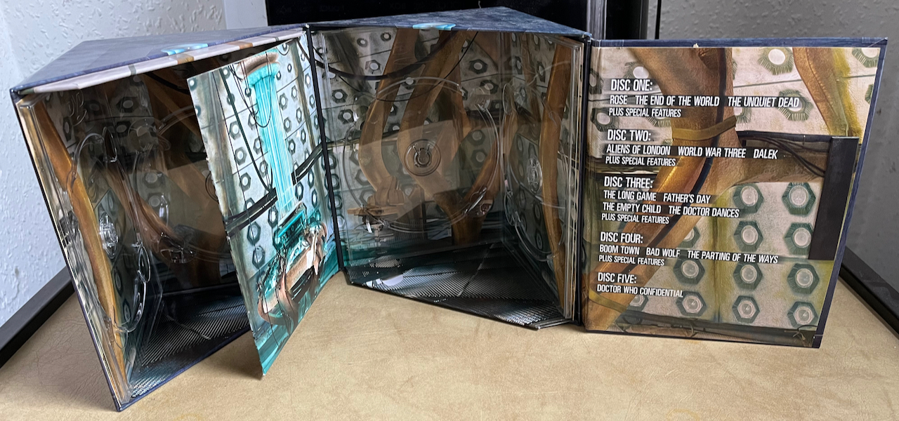 The DVD box set for Doctor Who Series 1, opened up to reveal the inside of the Tardis, with the spindles for the discs on the inner walls.