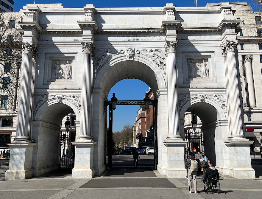 Marble Arch, a huge marble structure with 3 arches, the central one being taller and wider than the other two either side of it. There are 4 tall pillars across the structure as well, so each archway has a pillar either side of it.