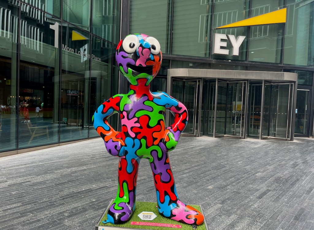 Apart Together, a statue of Morph covered in large, randomly shaped splodges of paint in various colours, that roughly fit together like a jigsaw.