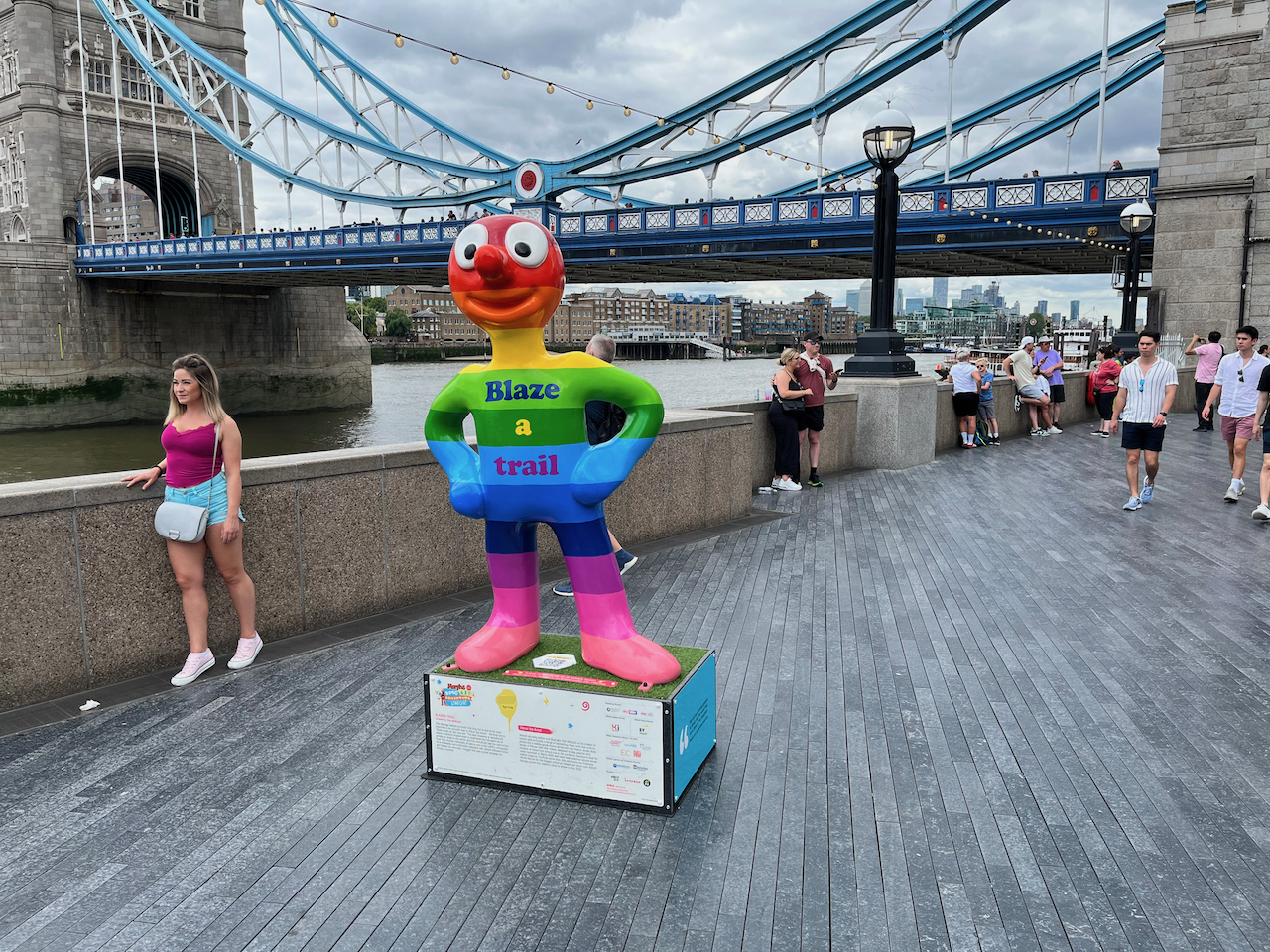 Blaze A Trail, a statue of Morph decorated in thick rainbow coloured stripes from head to toe.