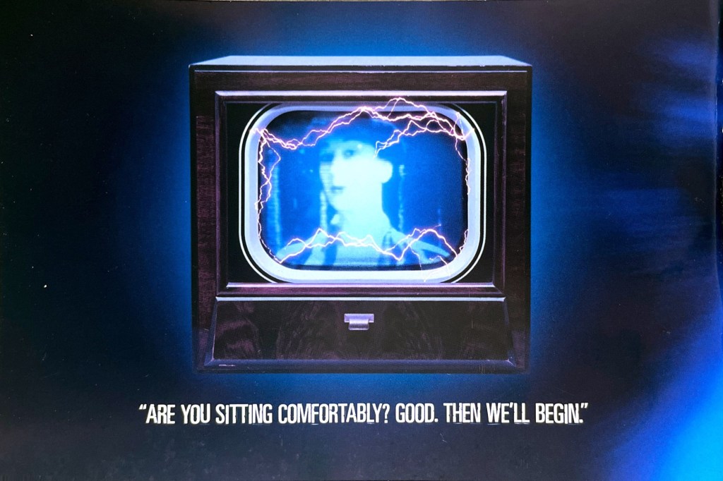 Image from the Doctor Who episode The Idiot's Lantern, featured in the DVD booklet for Series 2. It shows electricity bursting from the screen of an old-style TV set that shows a woman's head and shoulders. Text below the TV reads are you sitting comfortably? Then we'll begin.