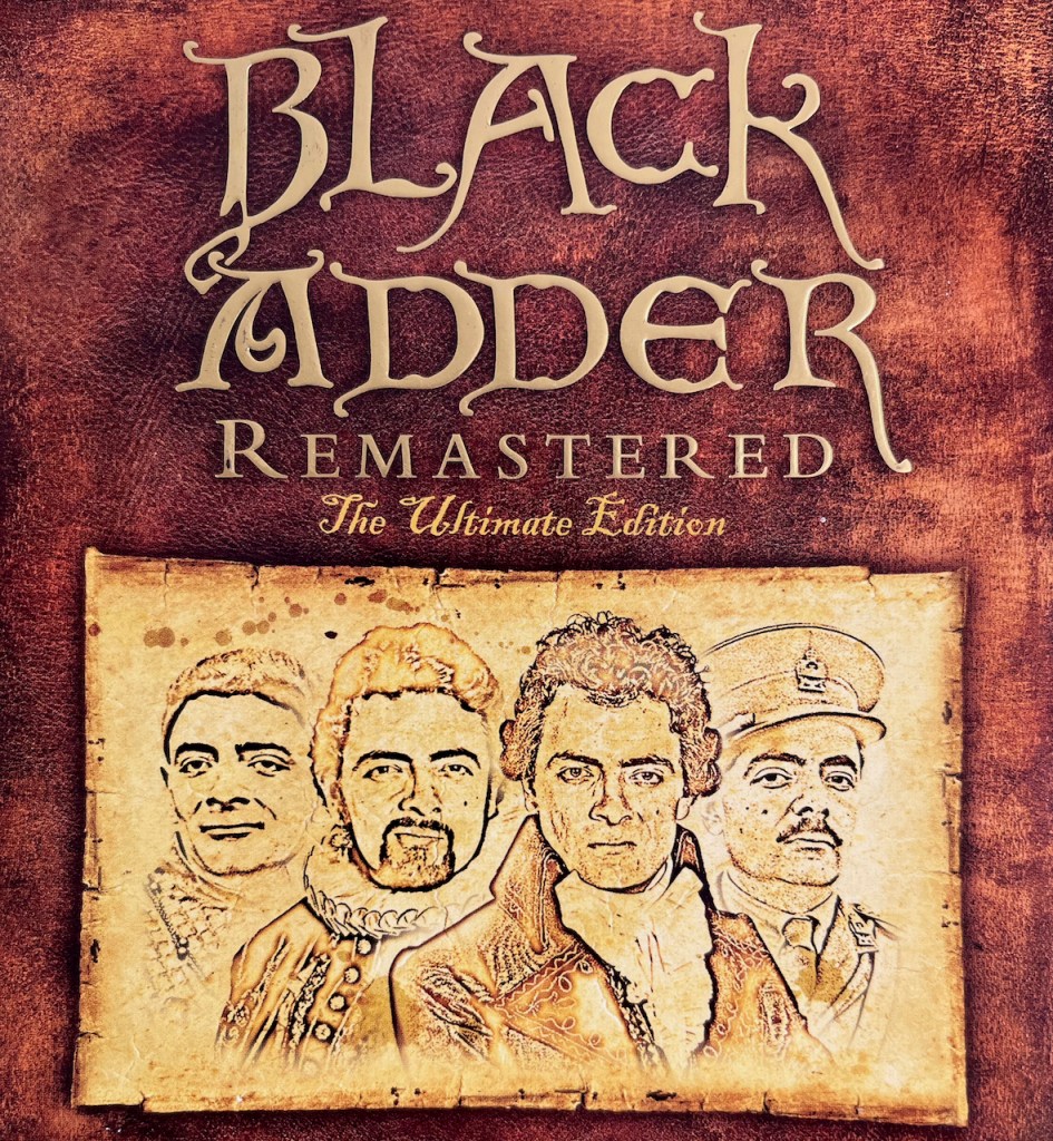 The cover of the Remastered Ultimate Edition DVD box set for Black Adder, featuring the show's title in embossed curly gold lettering, and a sketch showing the 4 iterations of the character from the main 4 series.