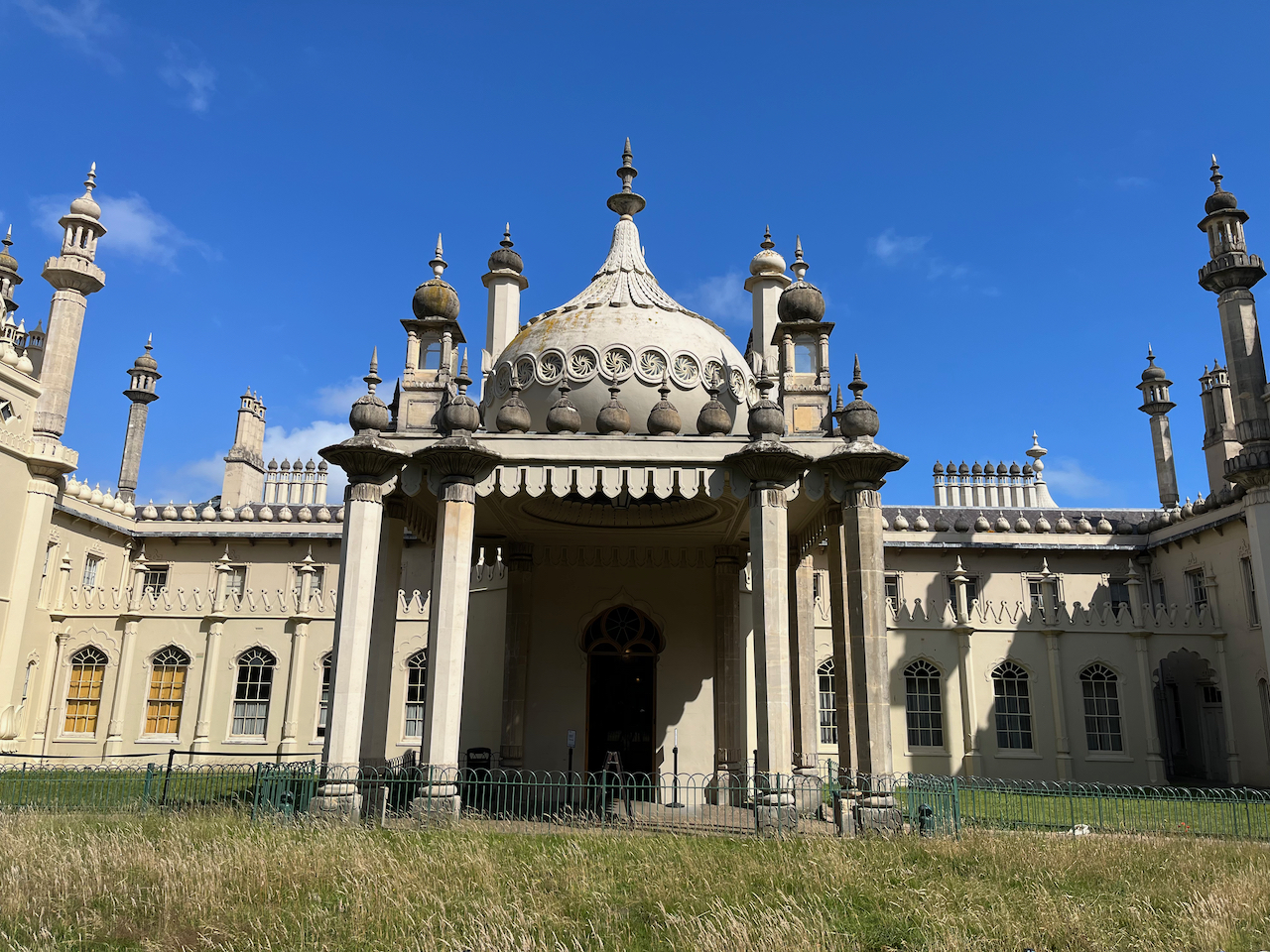 The ornate Royal Pavilion building, including a decorative dome with a pointed centre on the roof above the entrance.
