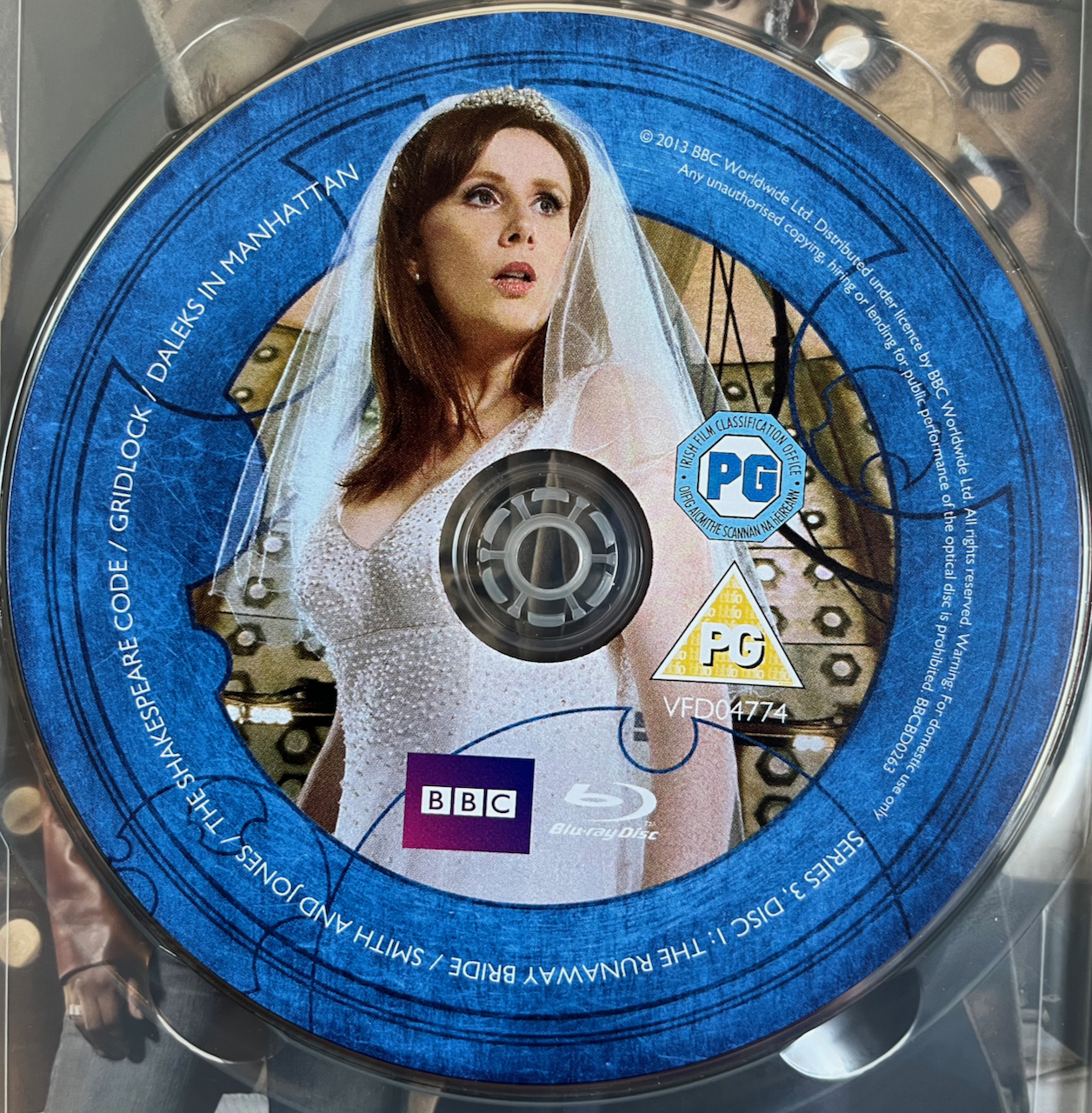 Disc 1 in the Doctor Who Series 3 Blu-ray set, featuring a photo of Donna Noble wearing a white wedding dress and veil. A blue border around the edge of the disc contains the episode names and copyright information.