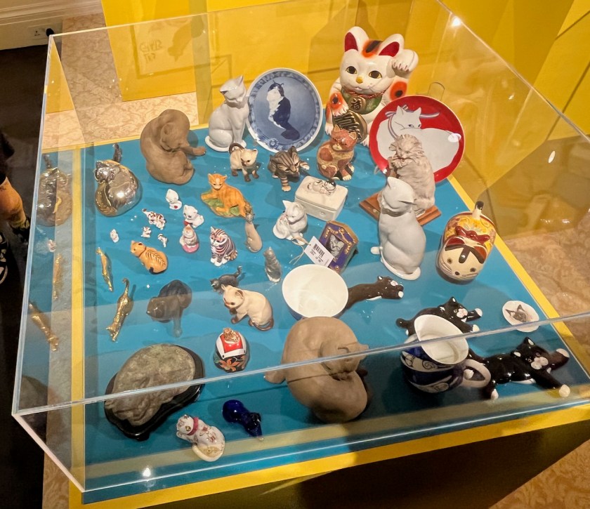 A cornucopia of cat ornaments in various sizes and designs.