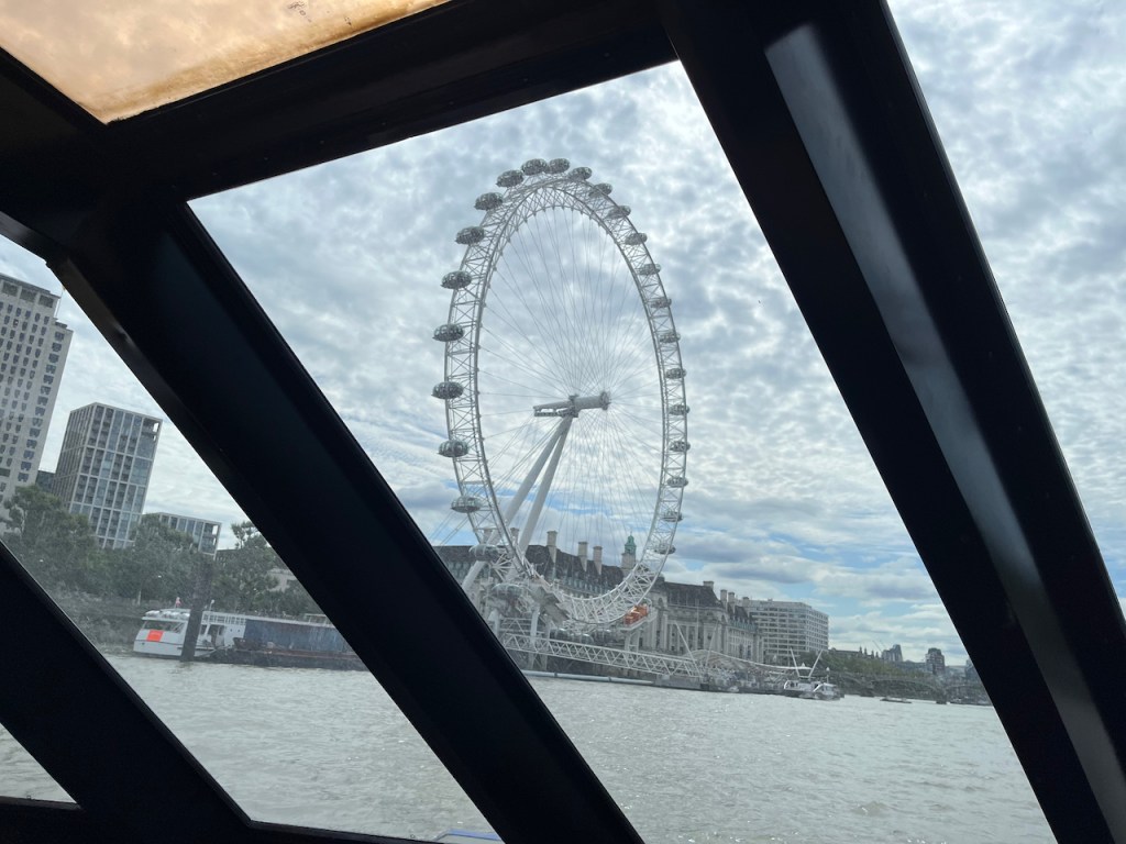The huge observational wheel known as the London Eye, viewed from the front of the Millennium of London boat.