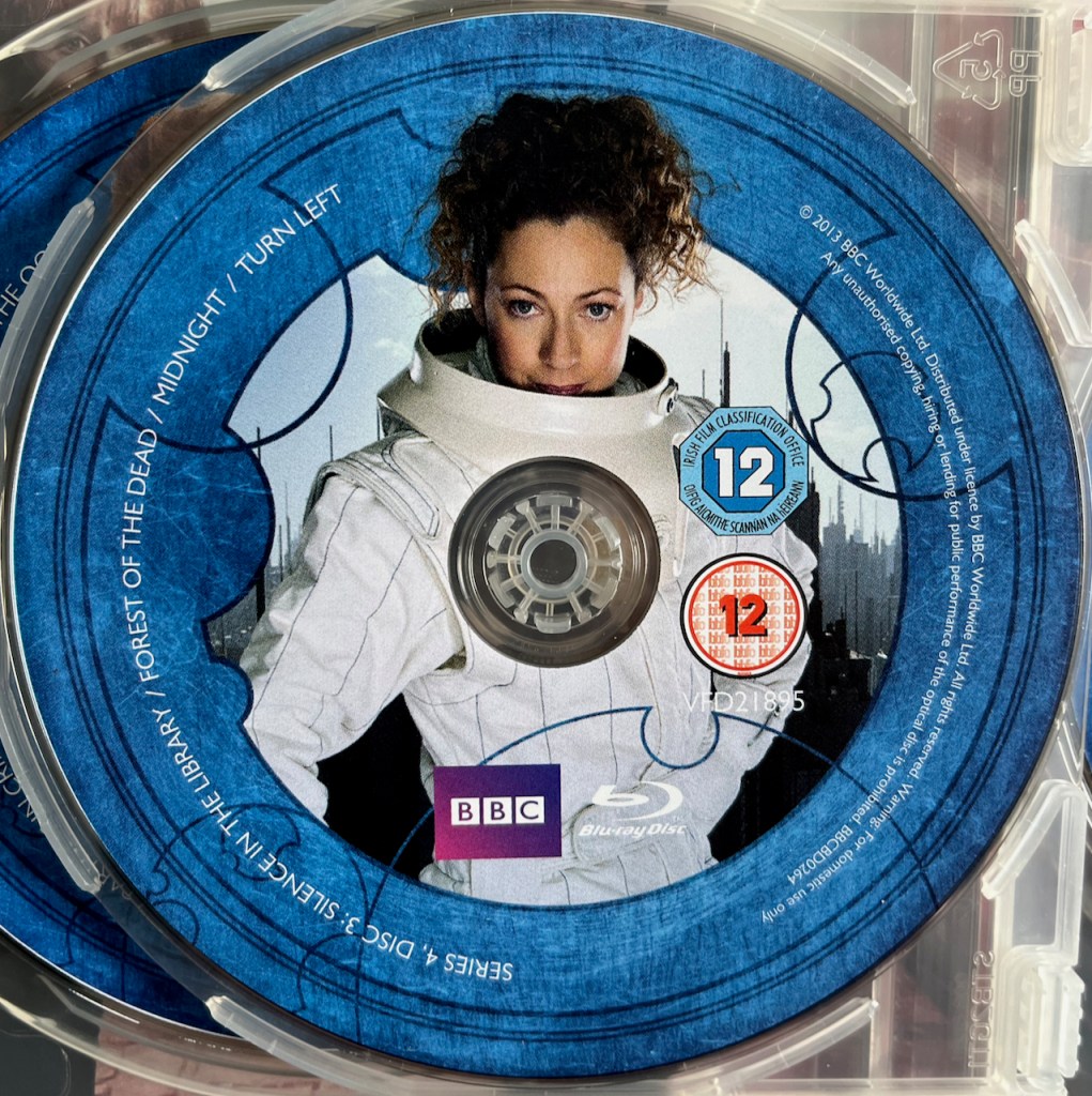 Disc 3 in the Doctor Who Series 4 Blu-ray set, featuring a photo of River Song in her white space suit. A blue border around the edge of the disc contains the episode names and copyright information.