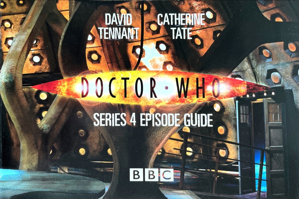 Title page from the Doctor Who Series 4 Episode Guide booklet included with the original DVD release. Against a backdrop of the inside of the Tardis, with its door open to reveal space beyond, the names David Tennant and Catherine Tate appear in white text above the fiery coloured Doctor Who logo. Below that is the episode guide title in white text, and then the white BBC logo is at the bottom of the page.