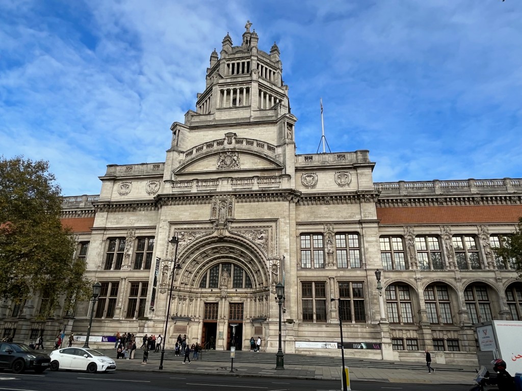 The outside of the Victoria and Albert Museum, with its large entrance archway.