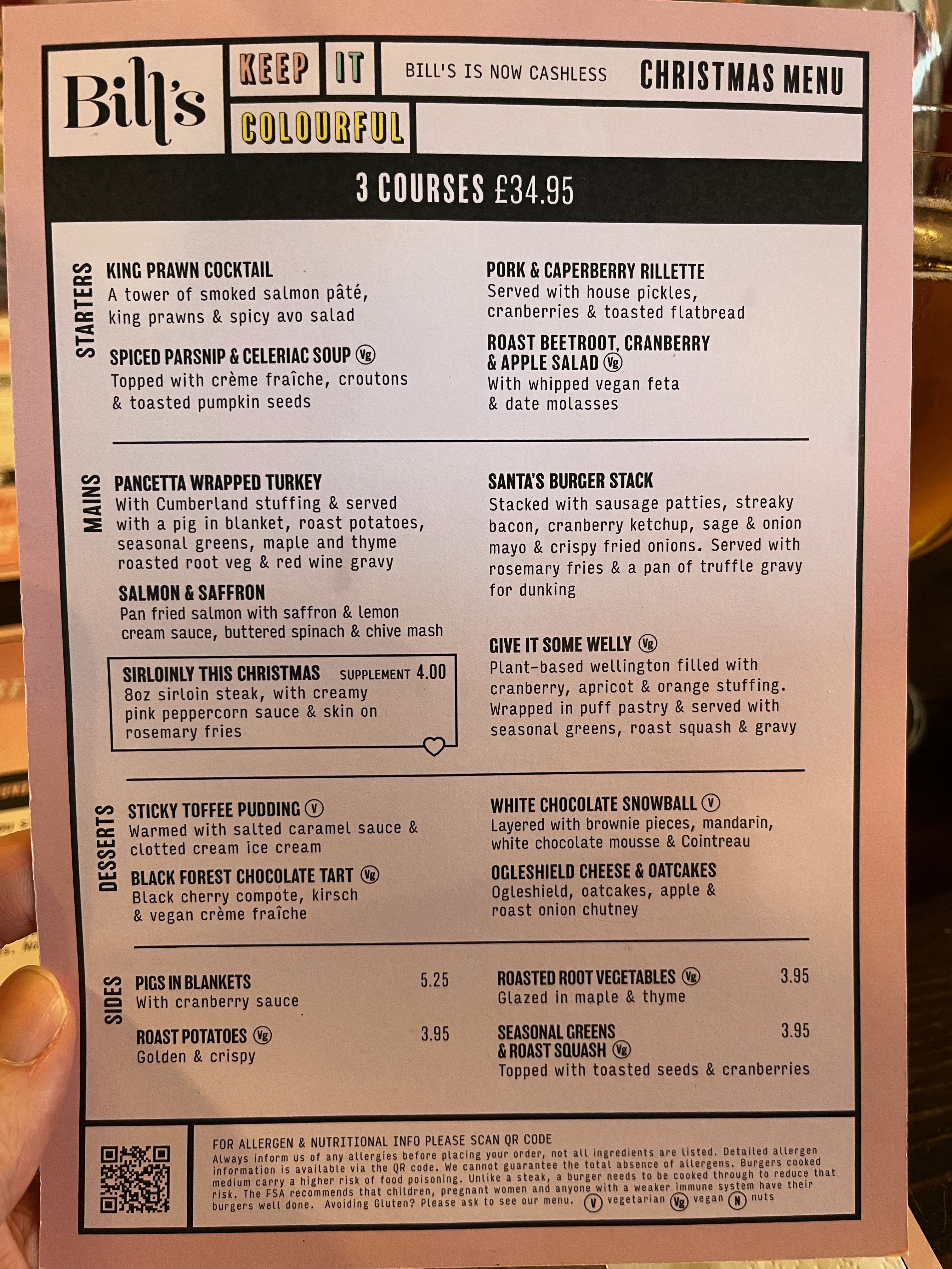 Bill's Christmas Menu, 3 courses from £32.95. Starters are King Prawn Cocktail, Spiced Parsnip and Celeriac Soup, Pork and Caperberry Rillette, and Roast Beetroot, Cranberry and Apple Salad. The mains are a Pancetta Wrapped Turkey, Salmon and Saffron, Sirloin Steak, Santa's Burger Stack, and a plant-based wellington. Desserts are Sticky Toffee Pudding, Black Forest Chocolate Tart, White Chocolate Snowball, and Ogleshield Cheese and Oatcakes.