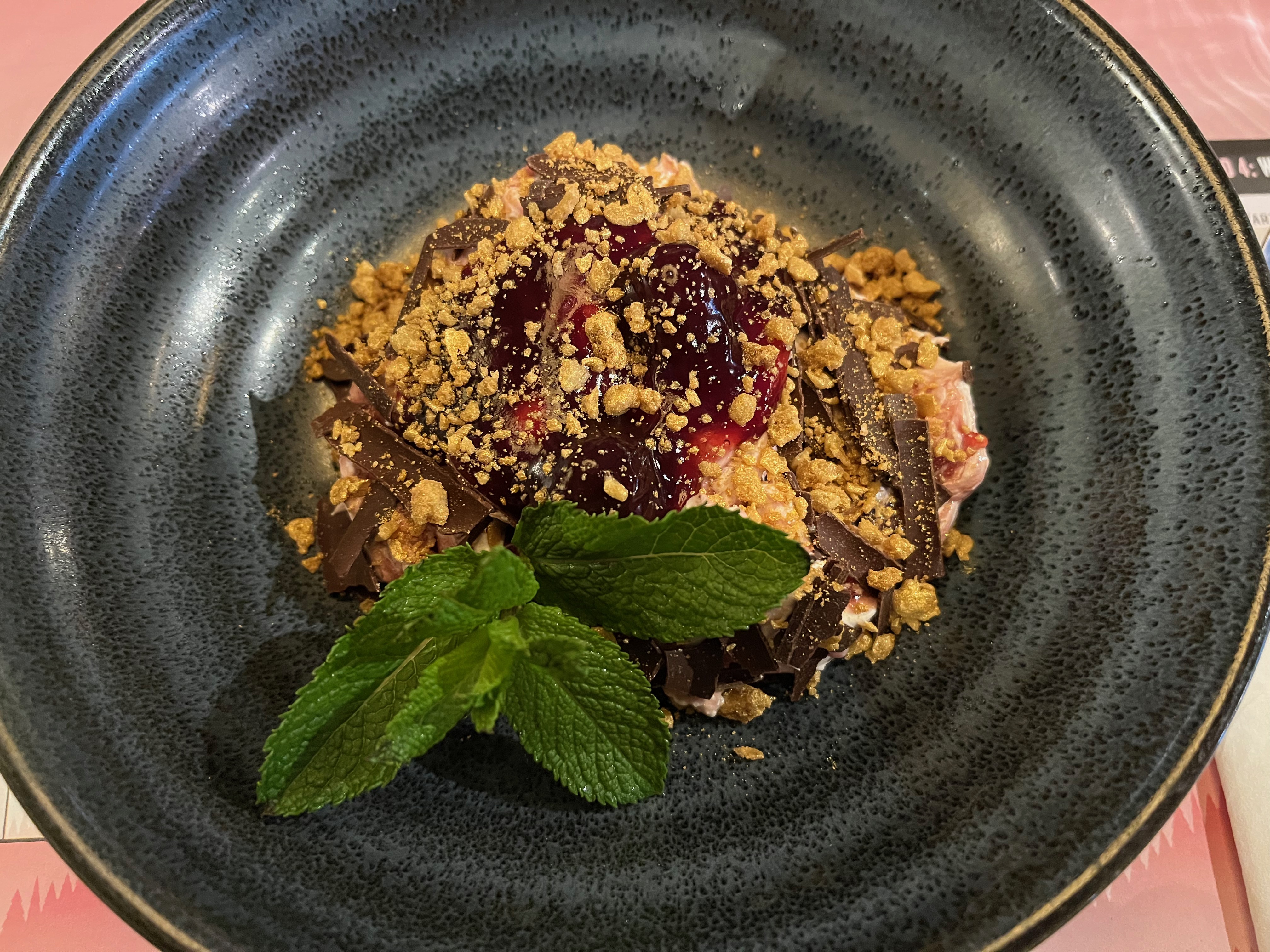 Merry Black Cherry & Dark Chocolate Eton Mess at Bill's, consisting of black cherries & kirsch with white chocolate mousse & meringue pieces, all topped with dark chocolate shavings & golden crumble.