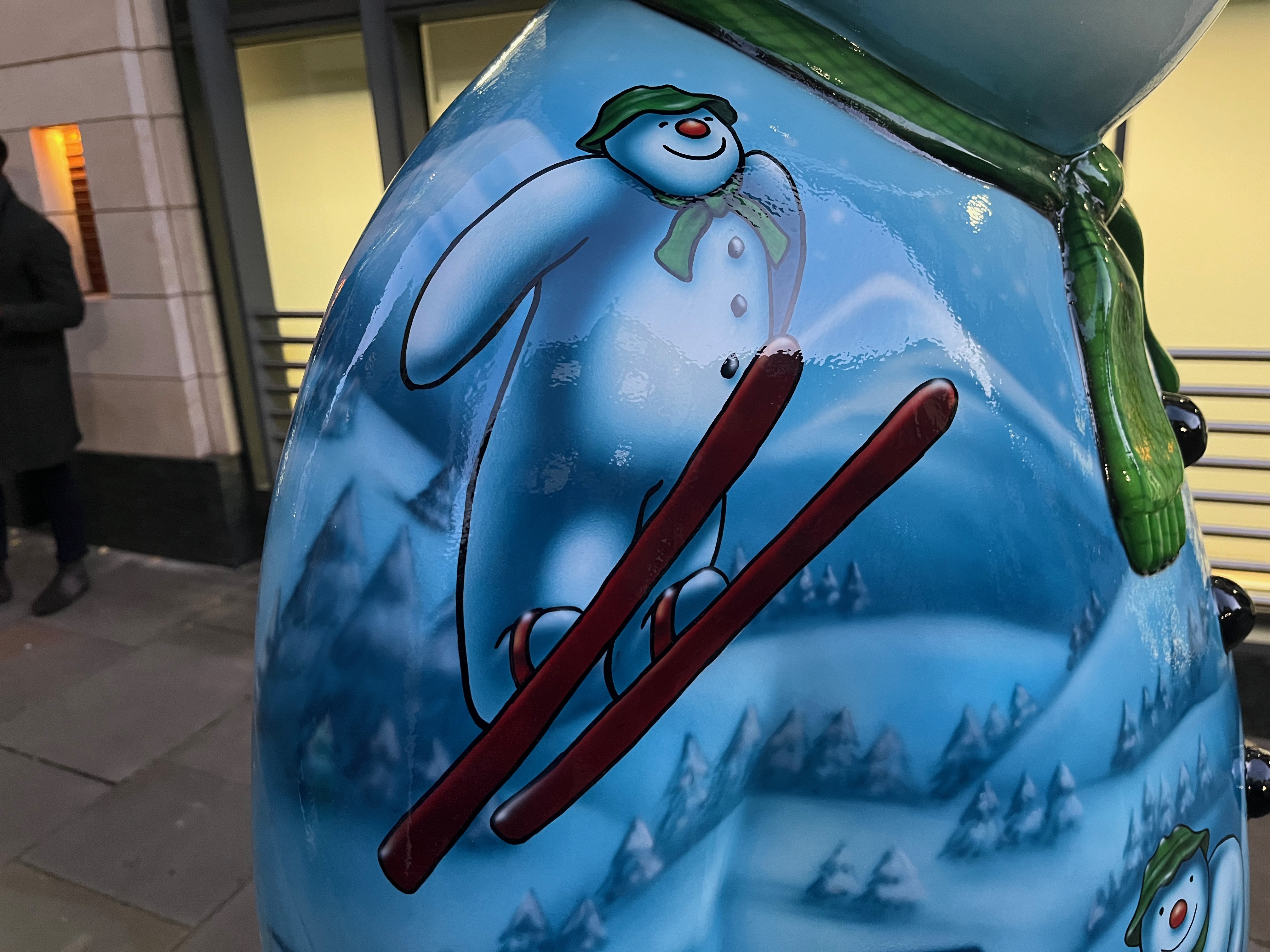 Close-up of the Ten Lords a-Leaping sculpture of the Snowman, showing the character flying through the air on skis.