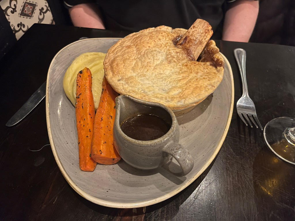 Slow Cooked Beef Rib, Shin & Pulled Brisket Pie, with gravy, carrots and mashed potato.