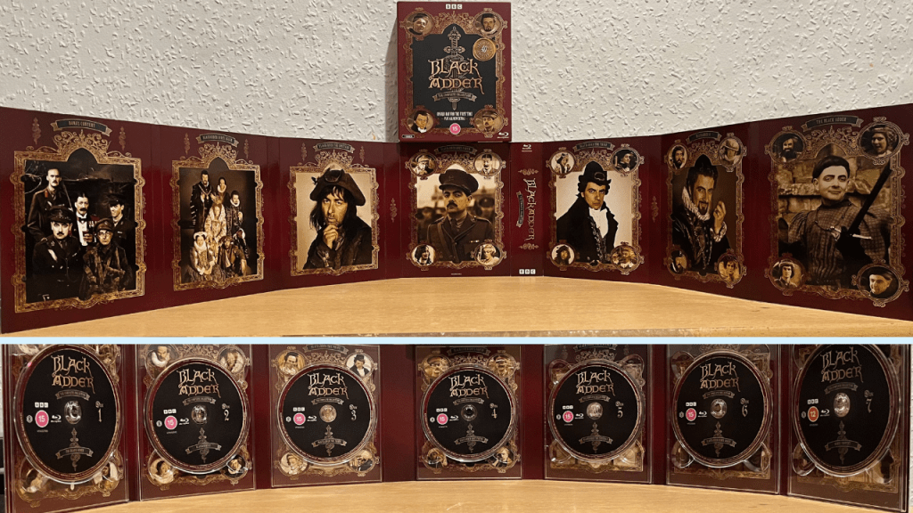The Blackadder 40th anniversary box set, unfolded so all the contents are visible. The top image shows the back of the unfolded set, with each section having a different photograph of Blackadder or another character, while the bottom image shows the other side with all 7 discs.