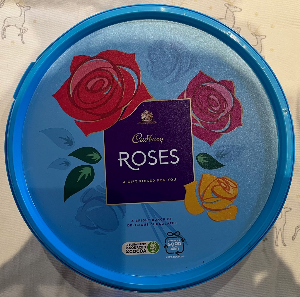 A blue tub of Cadbury's Roses.