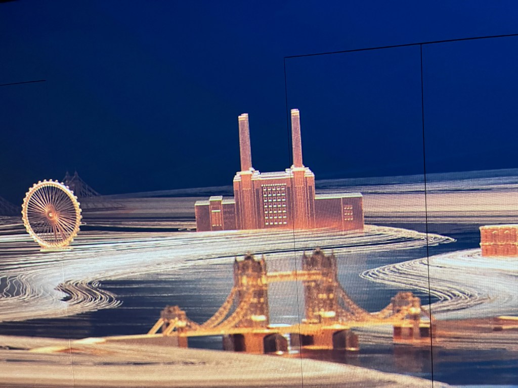An animation covering a wall, including images of Battersea Power Station, the London Eye and Tower Bridge.