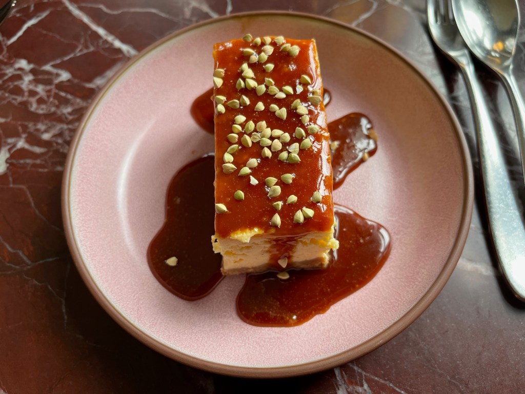 A baked cheesecake with Horlicks caramel sauce and lots of little crunchy biscuit bits on the top.