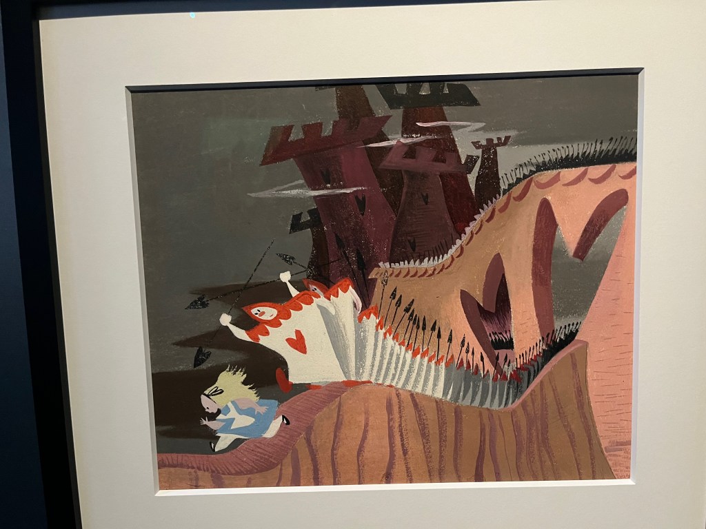 A coloured drawing of Alice from Alice in Wonderland, wearing her blue dress with white apron, running away along a winding narrow path as she's chased by a long line of heart playing cards that have heads, arms and legs.