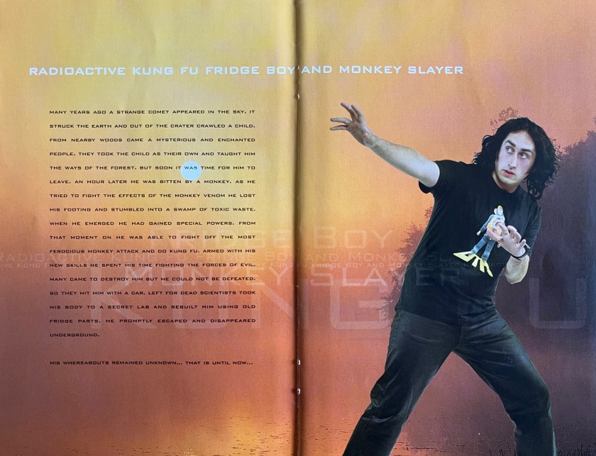 Double-page spread from the booklet with Ross Noble's Sonic Waffle DVD. On the right page is a photo of Ross in a kung fu stance, his legs apart as he leans back, one arm out straight in front of him. On the left page is text about how he became known as Radioactive Kung Fu Fridge Boy and Monkey Slayer.