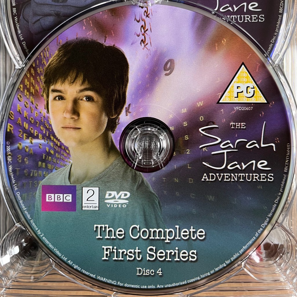 Series 1 Disc 4 from the DVD box set of The Sarah Jane Adventures, including a photo of Luke, a young white boy.