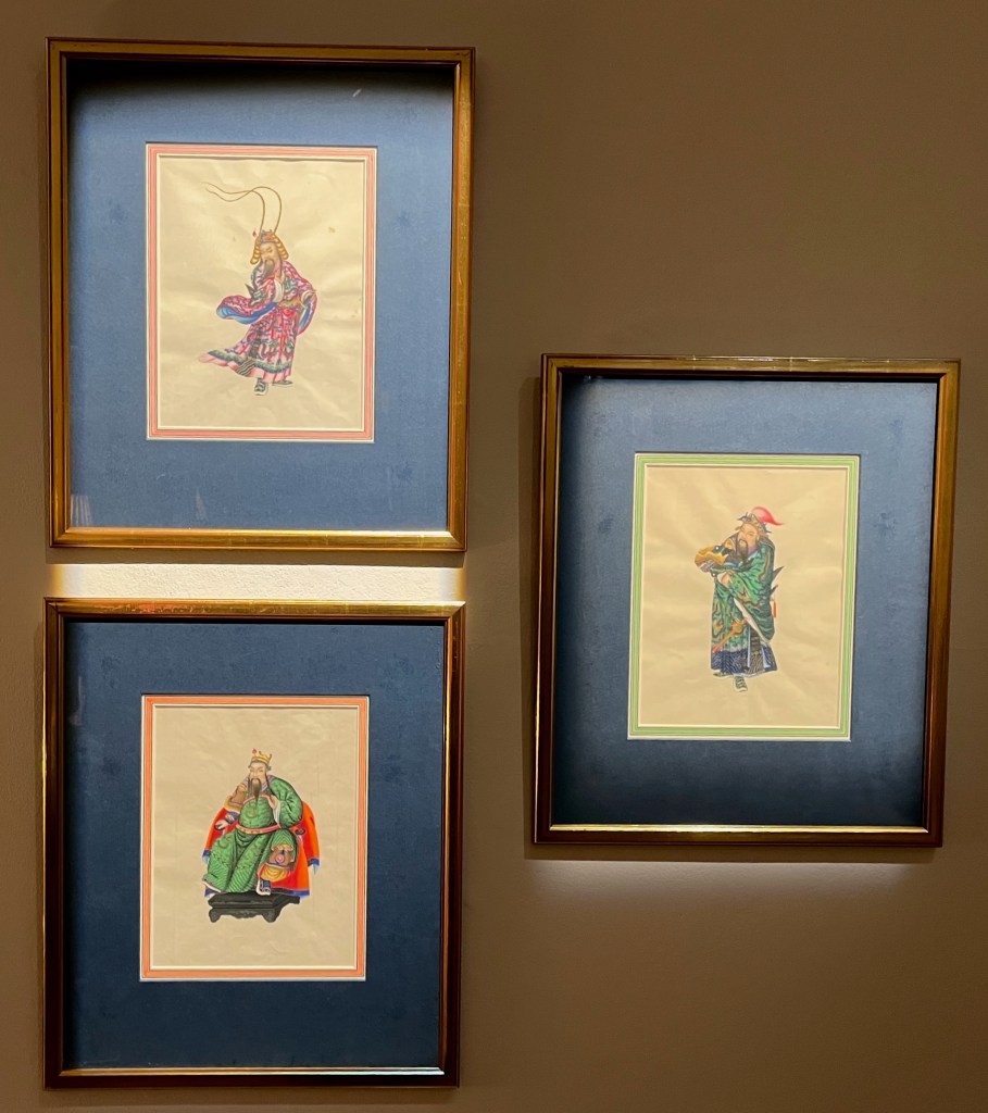 3 framed Chinese painting, each depicting a male figure with a moustache and pointed beard wearing a sumptuous colourful costume.