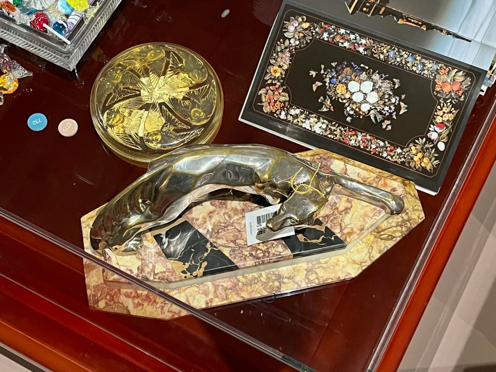 A couple of small ornate glass boxes by René Lalique.